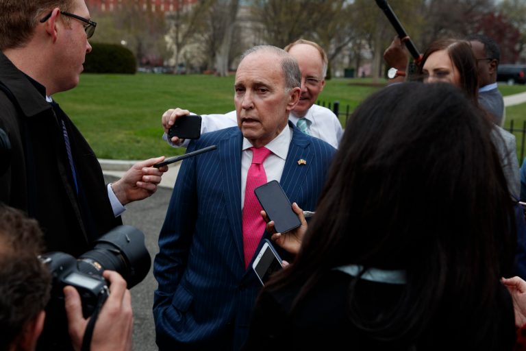 White House chief economic adviser Larry Kudlow talks with reporters outside the White House.