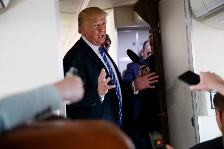 President Donald Trump talks with reporters aboard Air Force One on a flight to Andrews Air Force Base, Md.,, Thursday, April 5, 2018.