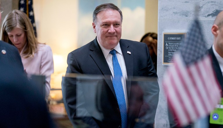 Secretary of State nominee Mike Pompeo leaves a meeting on Capitol Hill in Washington. 