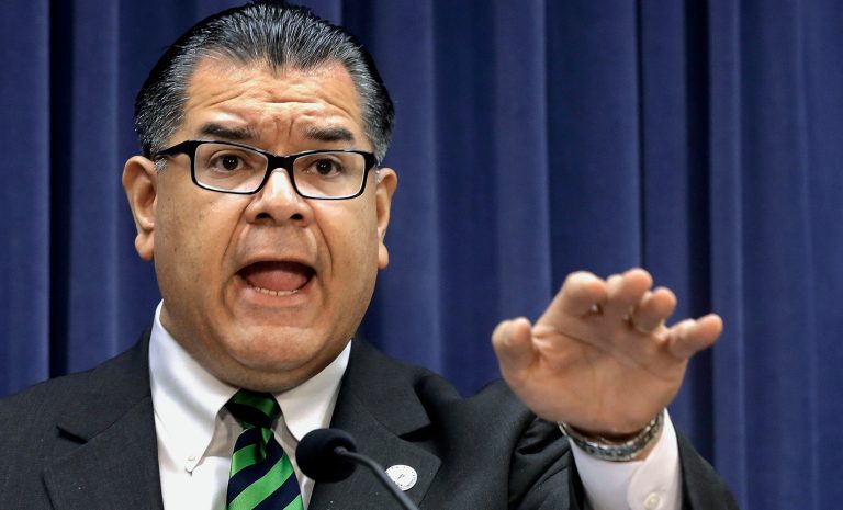 In this March 25, 2014 photo, Illinois Sen. Martin Sandoval, D-Cicero, speaks during a news conference at the Illinois state Capitol, in Springfield, Ill. 