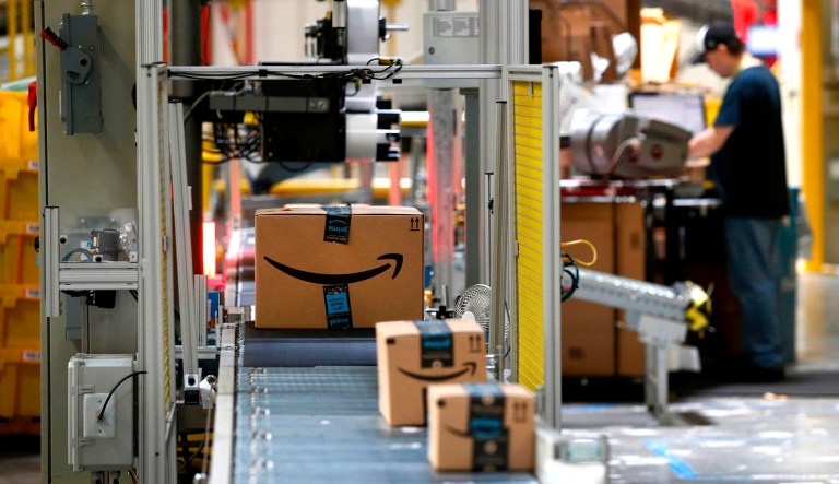 Packages pass through a scanner at an Amazon fulfillment center in Baltimore.