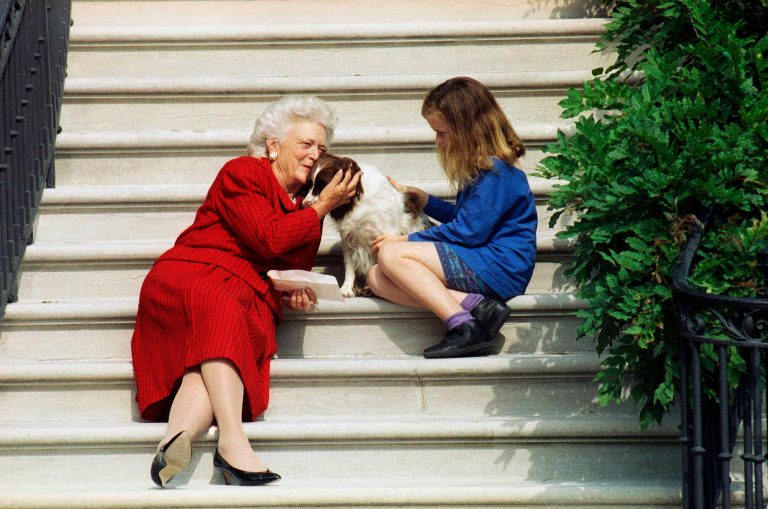 FILE - In this Sept. 13, 1991, file photo, first lady Barbara Bush, her granddaughter Barbara, and Millie wait on the steps of the White House for U.S. President George H.W. Bush to return from his check-up at Bethesda Naval Hospital in Washington. A family spokesman said Tuesday, April 17, 2018, that former first lady Barbara Bush has died at the age of 92.