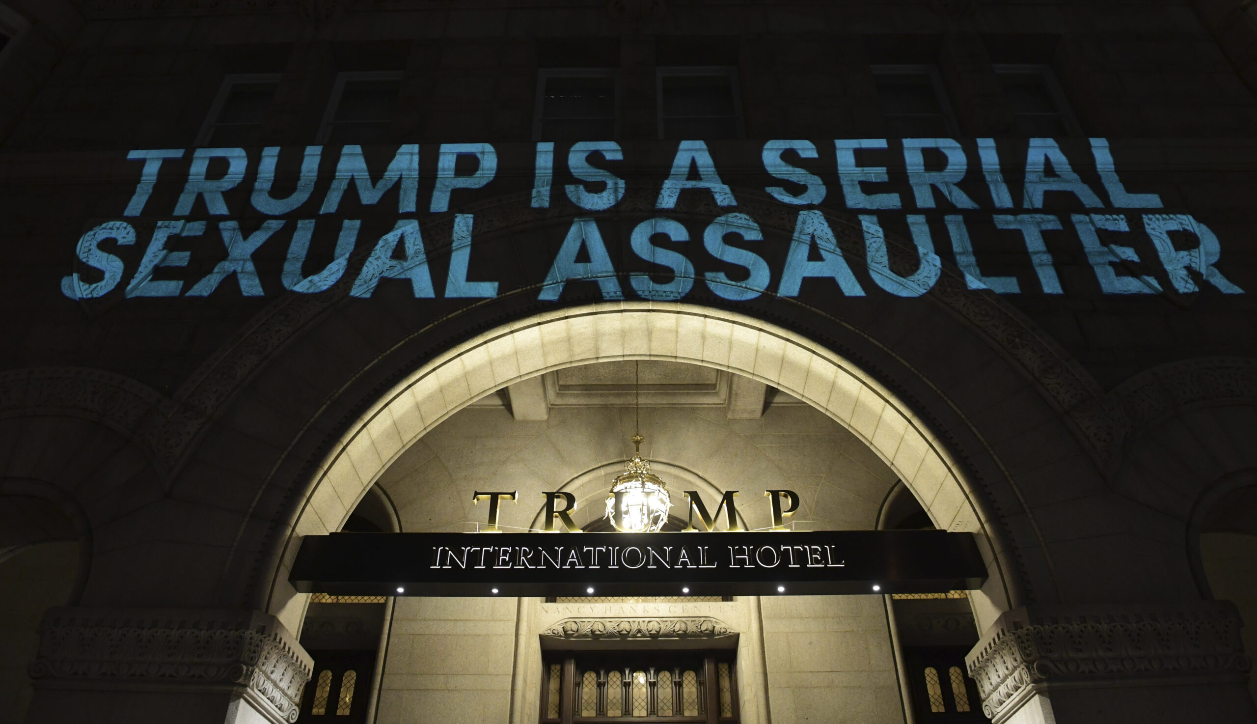 Activists project ‘morally unfit,’ ‘impeach Trump’ on Trump DC hotel