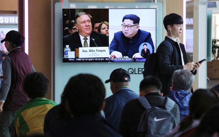 People watch a TV screen showing file footage of CIA Director Mike Pompeo, left, and North Korean leader Kim Jong Un during a news program at the Seoul Railway Station in Seoul on Wednesday. Pompeo recently traveled to North Korea to meet with leader Kim Jong Un, a highly unusual, secret visit undertaken as the enemy nations prepare for a meeting between President Trump and North Korean leader Kim Jong Un.