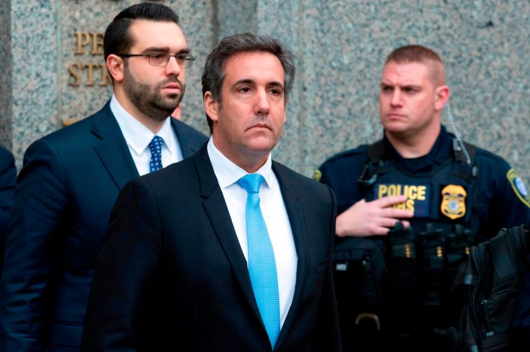 FILE - In a Monday, April 16, 2018, file photo, Michael Cohen, President Donald Trump's personal attorney, center, leaves federal court, in New York. Federal prosecutors said they can give President Donald Trump's personal lawyer, Cohen, copies of materials seized from him by the FBI by May 11. They notified a New York judge Wednesday.