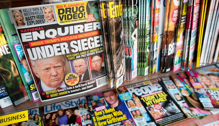 This July 12, 2017, file photo shows the cover of an issue of the National Enquirer featuring President Donald Trump at a store in New York. Karen McDougal, a former Playboy model who said she had a 10-month affair with President Donald Trump, settled her lawsuit Wednesday, April 18, 2018, with a supermarket tabloid over an agreement that prohibited her from discussing the relationship publicly.