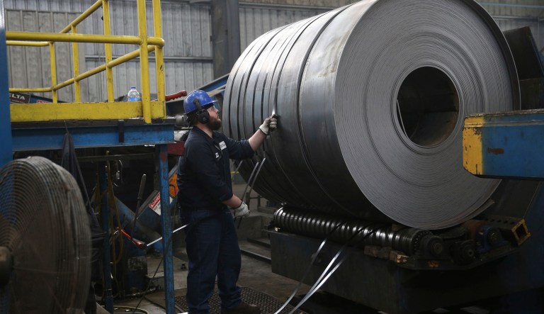 A worker straps down a steel coil at the Borusan Mannesmann steel pipe plant in Baytown, Texas. President Trump's escalating dispute with China over trade and technology is threatening jobs and profits in working-class communities where his "America First" agenda hit home. 