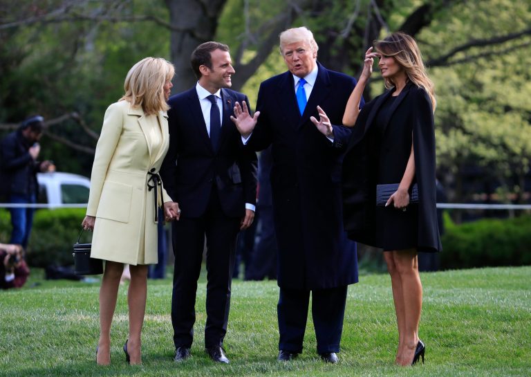 President Donald Trump, first lady Melania Trump, French President Emmanuel Macron and his wife Brigitte Macron, talk following a tree planting ceremony at the White House in Washington, Monday, April 23, 2018.
