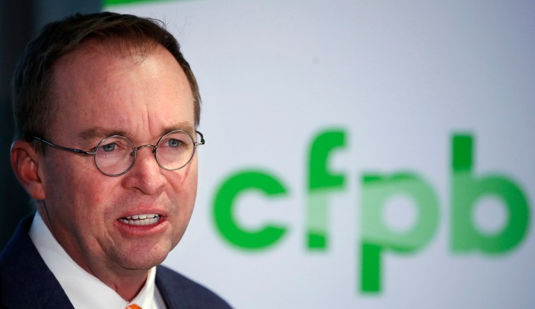 FILE - In this Nov. 27, 2017, file photo, Mick Mulvaney speaks during a news conference after his first day as acting director of the Consumer Financial Protection Bureau in Washington. The Dodd-Frank Act created a âBureau of Consumer Financial Protectionâ in 2010. But, except for the occasional court filing, the bureau was consistently referred to as the Consumer Financial Protection Bureau, or CFPB. Mulvaney took over the CFPB as acting director in late November. Since then, the bureau has increasingly referred to itself as the Bureau of Consumer Financial Protection, or by the acronym âBCFP.â
