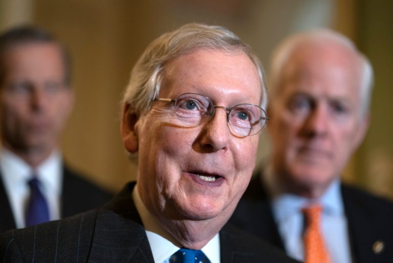 Senate Majority Leader Mitch McConnell, R-Ky., flanked by Sen. John Thune, R-S.D., left, and Majority Whip John Cornyn, R-Texas, speaks with reporters following a closed-door strategy session on Capitol Hill in Washington, Tuesday, April 24, 2018.