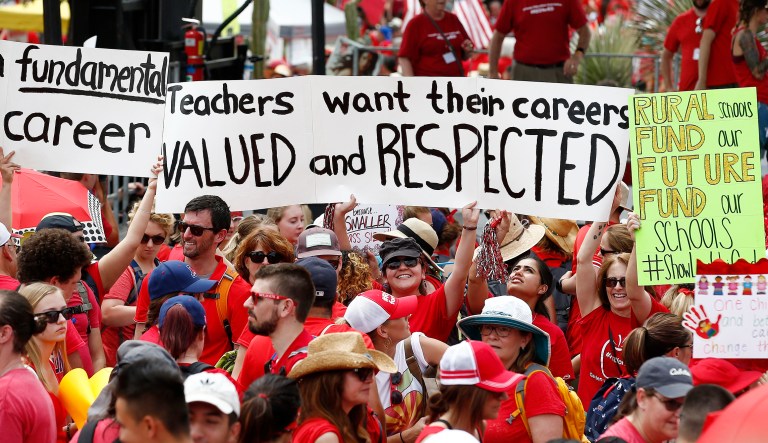 Thousands participate in a protest at the Arizona Capitol for higher teacher pay and school funding on the first day of a state-wide teachers strike, April 26, 2018, in Phoenix.