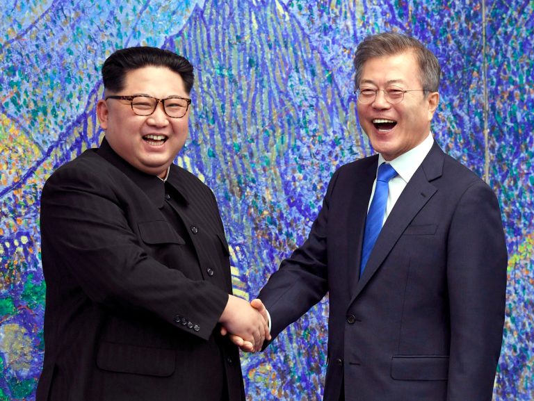 North Korean leader Kim Jong Un, left, poses with South Korean President Moon Jae-in for a photo inside the Peace House at the border village of Panmunjom in Demilitarized Zone Friday, April 27, 2018. Their discussions will be expected to focus on whether the North can be persuaded to give up its nuclear bombs.