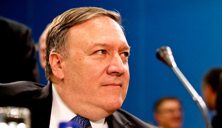 Secretary of State Mike Pompeo waits for the start of a meeting.