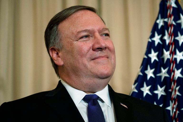 Secretary of State Mike Pompeo listens as President Donald Trump speaks during a ceremonial swearing in at the State Department, Wednesday, May 2, 2018, in Washington.