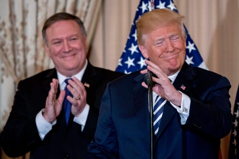 President Donald Trump, accompanied by Secretary of State Mike Pompeo, speaks during a ceremonial swearing in for Pompeo at the State Department, Wednesday, May 2, 2018, in Washington. 