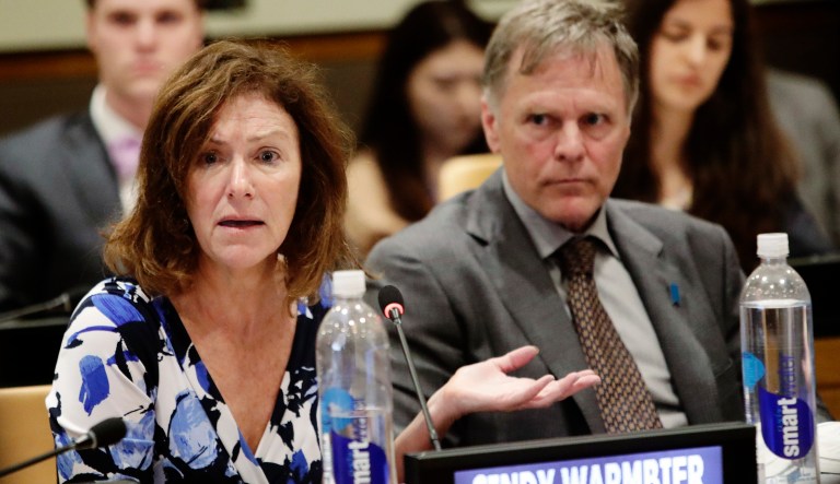 Fred Warmbier, right, listens as his wife Cindy Warmbier, speaks of their son Otto Warmbier, an American who died last year, days after his release from captivity in North Korea speaks during a meeting Thursday, May 3, 2018, at the United Nations headquarters.