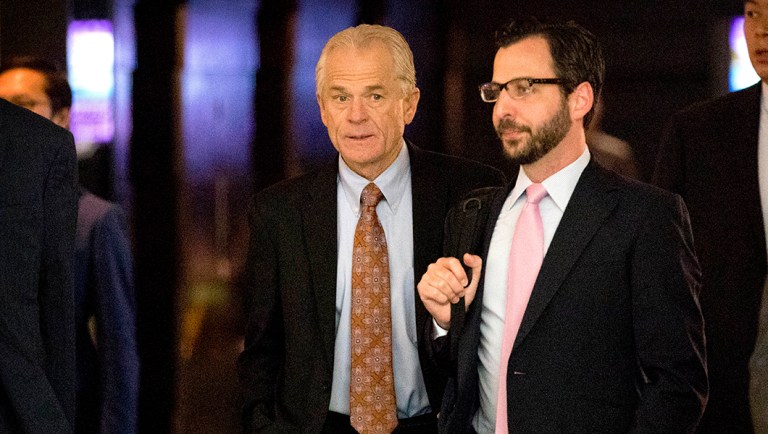 White House trade adviser Peter Navarro, left, leaves his hotel in Beijing, Friday, May 4, 2018. Chinese and U.S. officials met face-to-face Thursday to try and resolve a dispute over technology that has taken the world's two largest economies the closest they've ever come to a trade war.