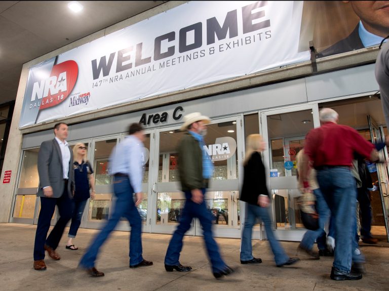 Attendees enter the National Rifle Association Annual Meeting on Friday at the Kay Bailey Hutchison Convention Center in Dallas.