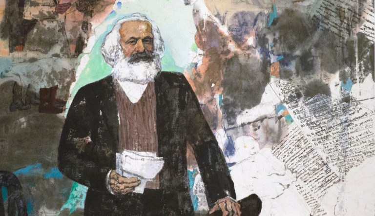 Visitors look at paintings at an exhibition to commemorate the 200th anniversary of the birth of Karl Marx at the National Museum in Beijing, May 5, 2018.