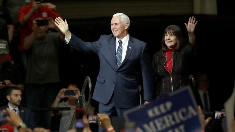 Vice President Mike Pence, left, and his wife Karen arrives onstage for a Republican campaign rally Thursday, May 10, 2018, in Elkhart, Ind.