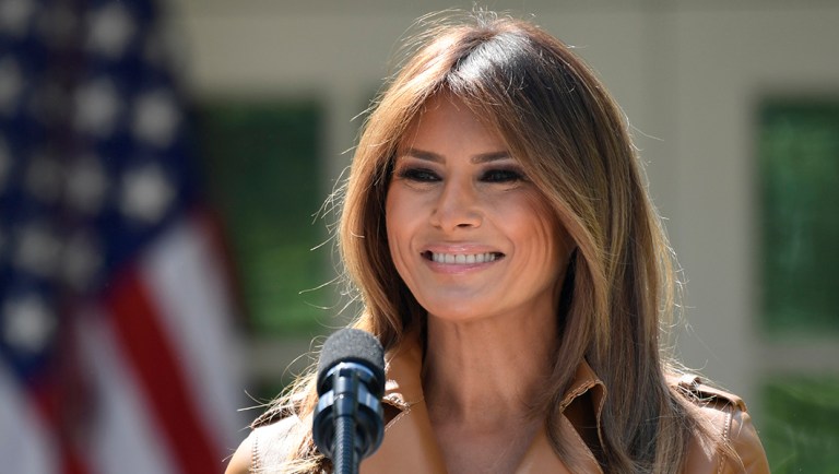 In this May 7, 2018 photo, First lady Melania Trump speaks on her initiatives during an event in the Rose Garden of the White House in Washington.  The White House says Melania Trump is hospitalized after undergoing a procedure to treat a benign kidney condition.