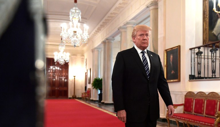 President Trump walks into the East Room of the White House in Washington, D.C.