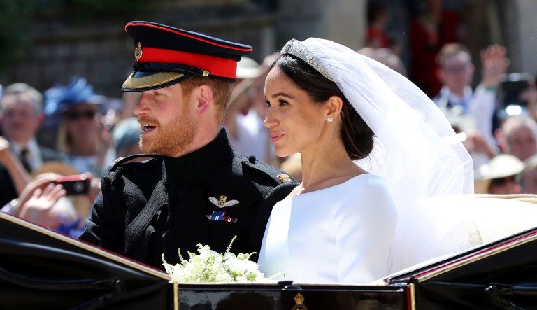 Meghan Markle and Prince Harry leave after their wedding at St. George's Chapel in Windsor Castle in Windsor, near London, England on Saturday.