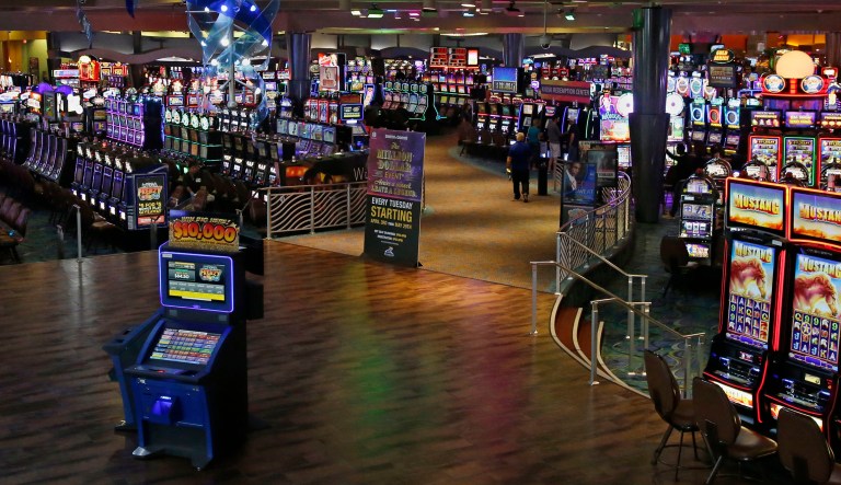 This May 21, 2018, photo shows the gaming floor at Riverwind Casino in Norman, Okla. Oklahoma's Native American tribes are prepared to offer sports betting at some of the more than 100 casinos across the state, but so far the state's Legislature hasn't reached an agreement on how to do that.