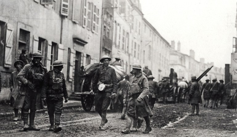 This photo, dated from Nov. 11, 1918, shows the first American wagons to enter Stenay, Meuse region, eastern France, under command of Lt. R. M. Huten, Company A, 353rd Regiment infantry, 99th Division.