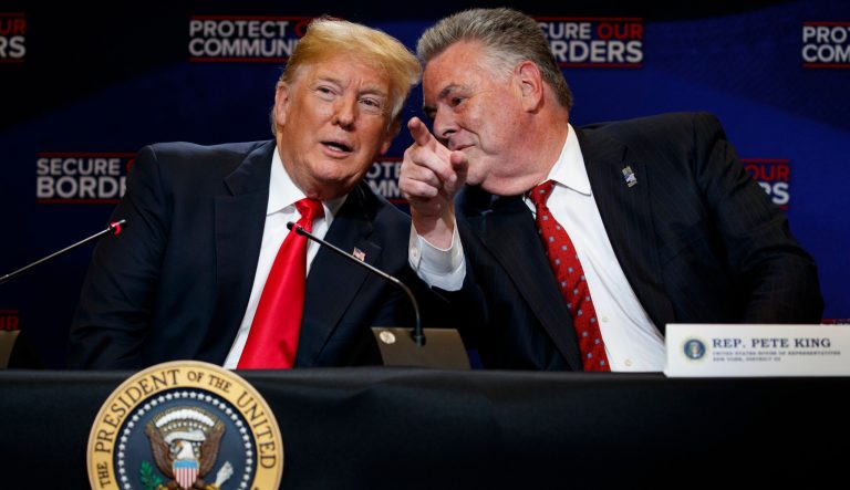President Donald Trump talks with Rep. Peter King, R-N.Y., during a roundtable on immigration policy at Morrelly Homeland Security Center, Wednesday, May 23, 2018, in Bethpage, N.Y. 