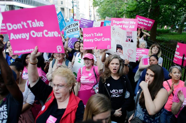Supporters of Planned Parenthood react to speakers at a rally, Thursday, May 24, 2018, in New York.