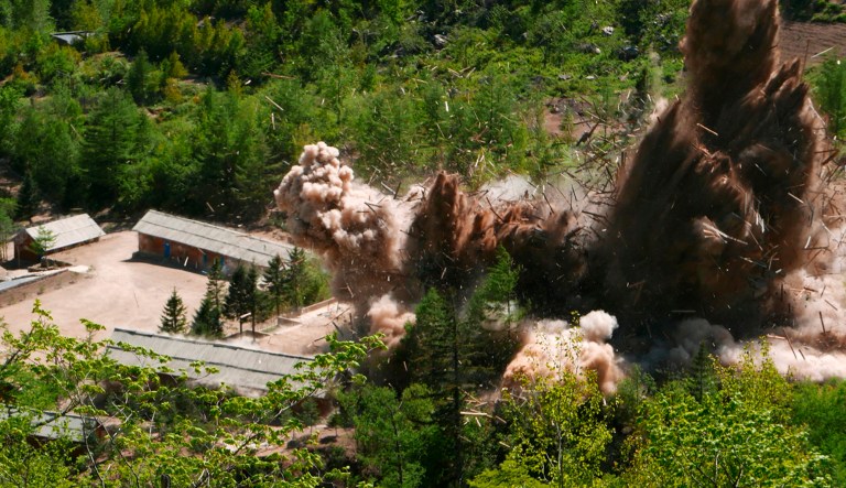 Smoke and debris rise in the air as barracks buildings for guards and tunneling workers at North Korea's nuclear test site are blown up at Punggye-ri, North Korea.