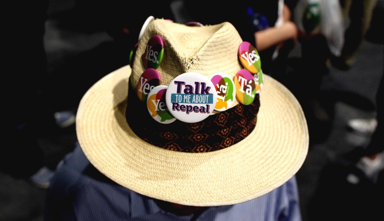 A person from the "Yes" campaign poses for a photograph as the results of the votes begin to come in, after the Irish referendum on the 8th Amendment of the Irish Constitution at the RDS count centre, in Dublin, Ireland on Saturday.