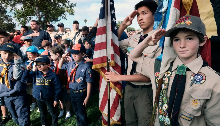 Boy Scouts and Cub Scouts salute the flag during ceremonies at the Los Angeles National Cemetery in Los Angeles on Saturday, May 26, 2018. More than 6,000 Scouts, with the support of local community members, placed 88,000 American flags on graves throughout the cemetery to honor fallen service members in anticipation of Memorial Day. 