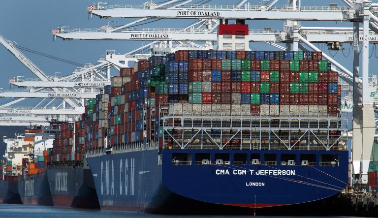 Container ships are unloaded at the Port of Oakland in Oakland, Calif. On Friday, the Commerce Department issues the second of three estimates of how the U.S. economy performed in the second quarter. 
