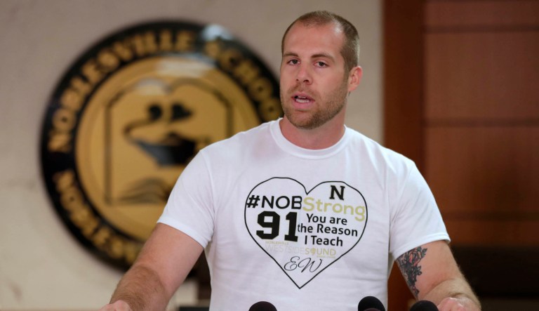 Jason Seaman, a seventh grade science teacher at Noblesville West Middle School in Noblesville, Ind., speaks to the media during a press conference Monday. Seaman tackled and disarmed a student with a gun at the school on Friday. He was shot but not seriously injured.