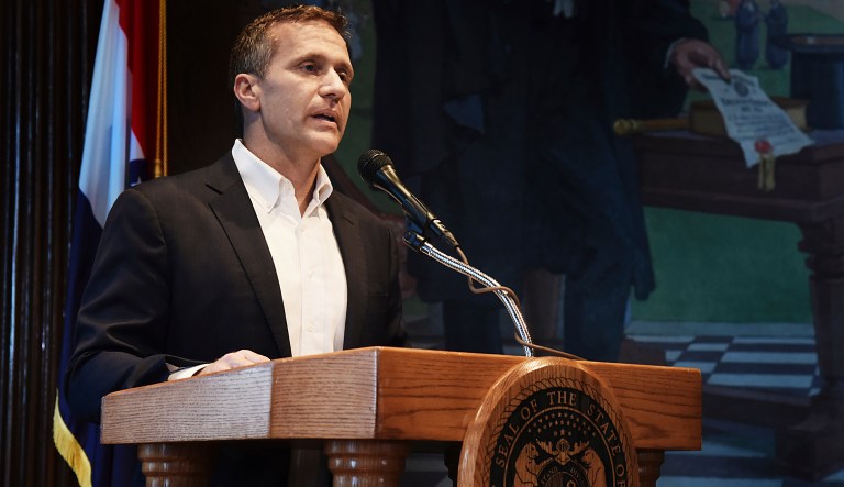 Missouri Gov. Eric Greitens reads from a prepared statement as he announces his resignation during a news conference, Tuesday, May 29, 2018, at the state Capitol, in Jefferson City, Mo. Greitens resigned amid a widening investigation that arose from an affair with his former hairdresser. Greitens said his resignation would take effect Friday.