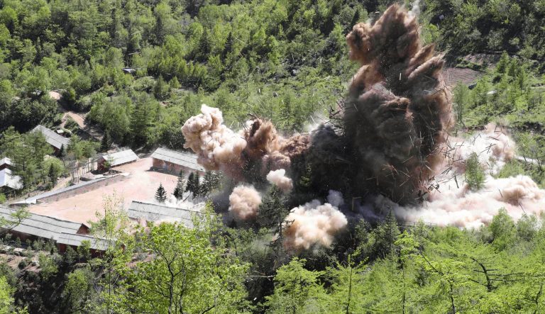 In this Thursday, May 24, 2018 photo, command post facilities of North Korea's nuclear test site are blown up in Punggye-ri, North Korea.