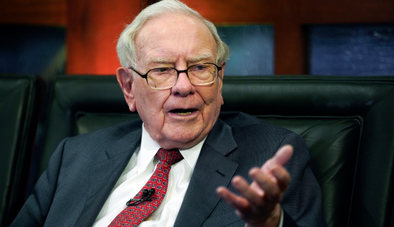 FILE - In this May 7, 2018 file photo, Berkshire Hathaway Chairman and CEO Warren Buffett speaks during an interview in Omaha, Neb. The price of a private lunch with Buffett could set another record this year because the bidding is already over $3 million. The online auction that raises money for the Glide Foundationâs work to help the homeless in San Francisco wraps up Friday night, June 1, 2018. 