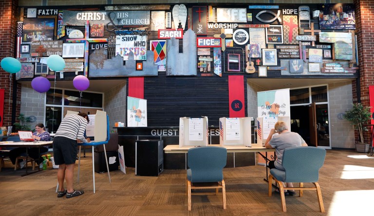 Voters fill in their ballots while voting in the Iowa Primary at the Valley Evangelical Church, Tuesday, June 5, 2018, in West Des Moines, Iowa. 