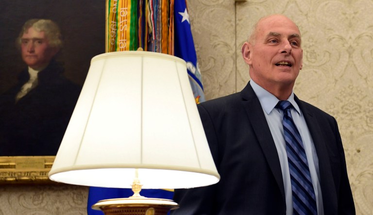 White House chief of staff John Kelly sits in the Oval Office of the White House as President Donald Trump signs "The Childhood Cancer Survivorship, Treatment, Access, and Research Act of 2018," Tuesday, June 5, 2018. 