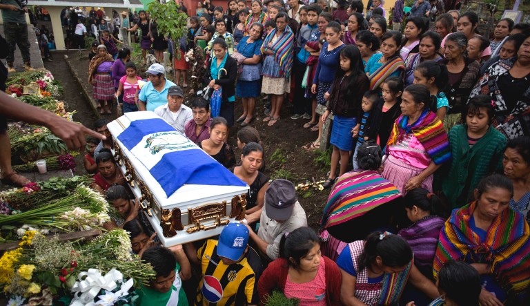 Family members of Erick Rivas, 20, who died in the hospital after suffering burns from the eruption of the Volcan de Fuego, which in Spanish means Volcano of Fire, carry his remains to the cemetery in San Juan Alotenango, Guatemala.