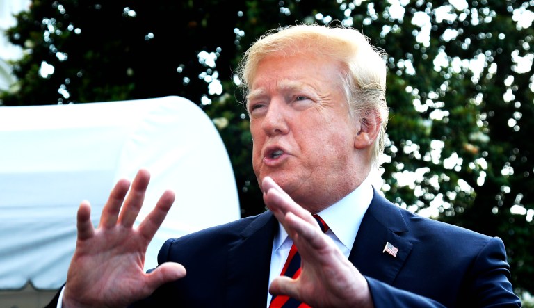 President Trump speaks to reporters before leaving the White House in Washington on Friday to attend the G7 Summit in Charlevoix, Quebec, Canada.
