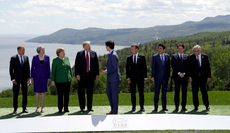 From left, President of the European Council Donald Tusk, British Prime Minister Theresa May, German Chancellor Angela Merkel, U.S. President Donald Trump, Canadian Prime Minister Justin Trudeau, French President Emmanuel Macron, Japanese Prime Minister Shinzo Abe, Italian Prime Minister Giuseppe Conte and President of the European Commission Jean-Claude Juncker gather for the family photo at the G-7 summit, Friday, June 8, 2018, in Charlevoix, Canada.