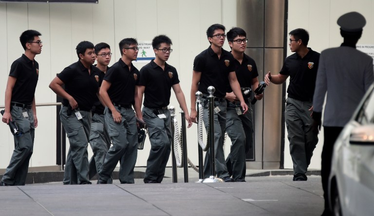 Members of the Singapore military's bomb disposal enter the St Regis Hotel in Singapore on Saturday, ahead the summit between President Trump and North Korea leader Kim Jong Un.