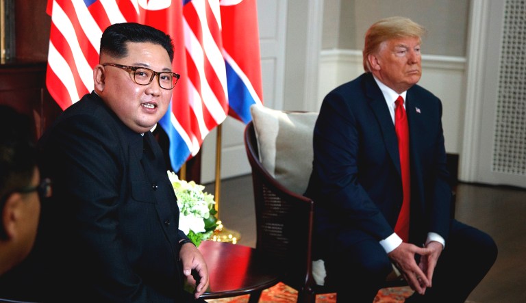 President Trump (right) meets with North Korean leader Kim Jong Un on Sentosa Island, Tuesday, in Singapore.