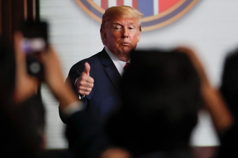 U.S. President Donald Trump flashes a thumbs up as he leaves after a press conference at the Capella resort on Sentosa Island Tuesday, June 12, 2018 in Singapore.