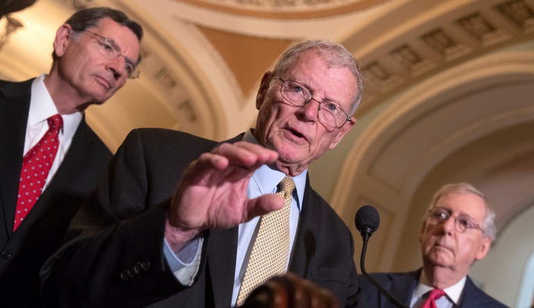 Sen. James Inhofe, R-Okla., a member of the Senate Armed Services Committee, center, joined by Sen. John Barrasso, R-Wyo., left, and Senate Majority Leader Mitch McConnell, R-Ky., talks about defense funding during a news conference.