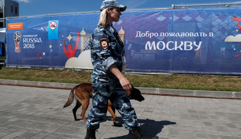 FILE - In the June 16, 2018 file photo a police officer patrols outside the stadium ahead of the group D match between Argentina and Iceland at the 2018 soccer World Cup in the Spartak Stadium in Moscow, Russia.