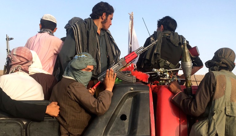 Taliban fighters ride in their vehicle in Surkhroad district of Nangarhar province, east of Kabul, Afghanistan, on June 16.